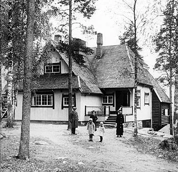 Jean Sibelius at his desk in his home, Ainola, in the early 20th century.