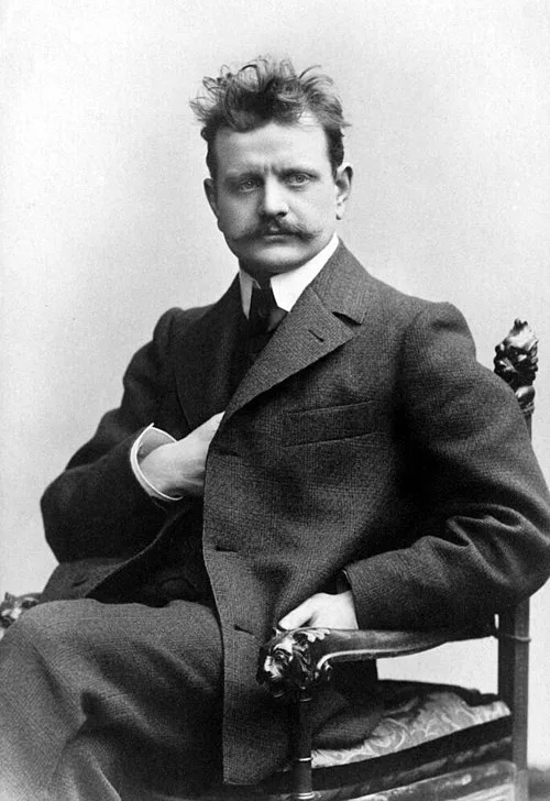 Sibelius in 1890, holding a violin, during the period he still harbored ambitions of being a virtuoso performer.