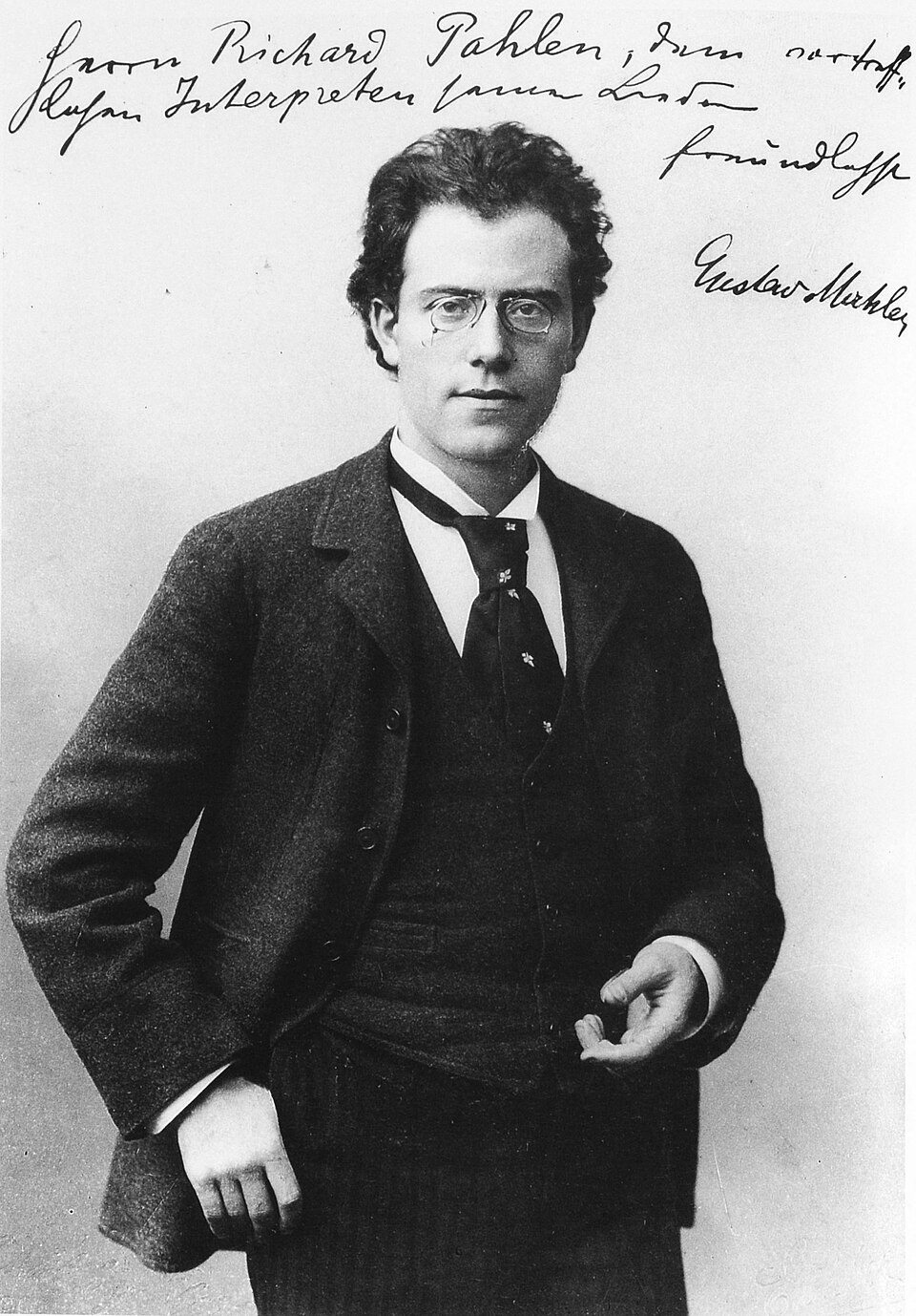 Black-and-white portrait photograph of a young Gustav Mahler with a handwritten dedication