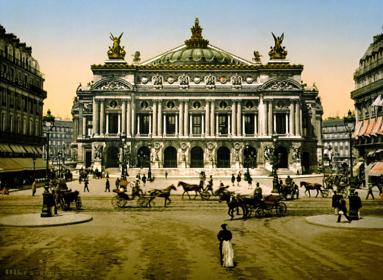 The Palais Garnier opera house in Paris in a vintage colour photochrom, with carriages and pedestrians out front