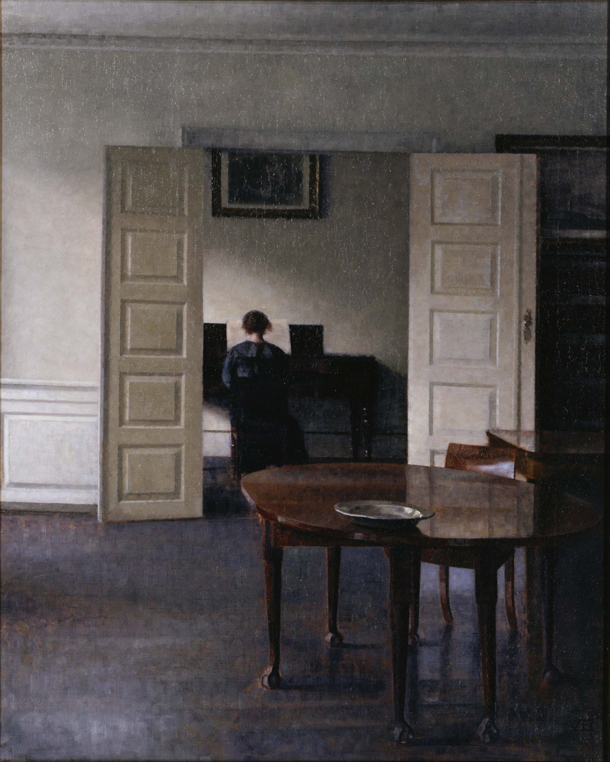 Vilhelm Hammershoi painting of a grey, sparsely furnished interior with a woman seated at an upright piano, seen from behind