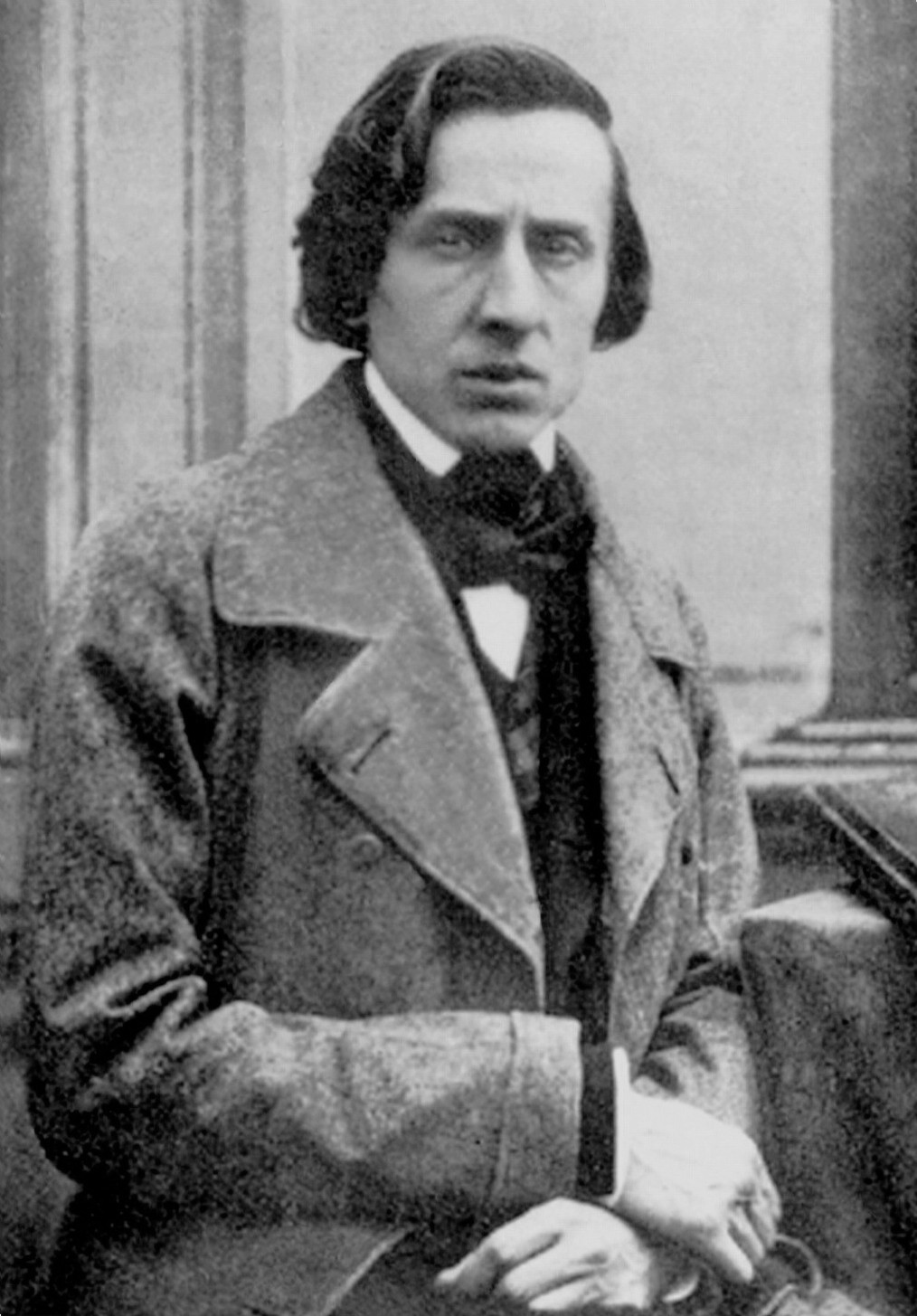 Nineteenth-century photographic portrait of Frederic Chopin in a dark coat, seated and looking to the side