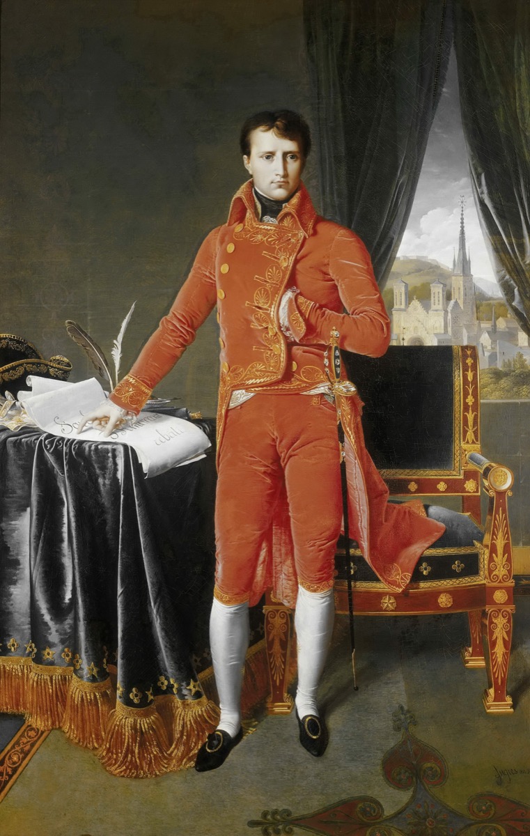 Ingres portrait of Napoleon Bonaparte as First Consul, standing in red velvet coat beside a desk
