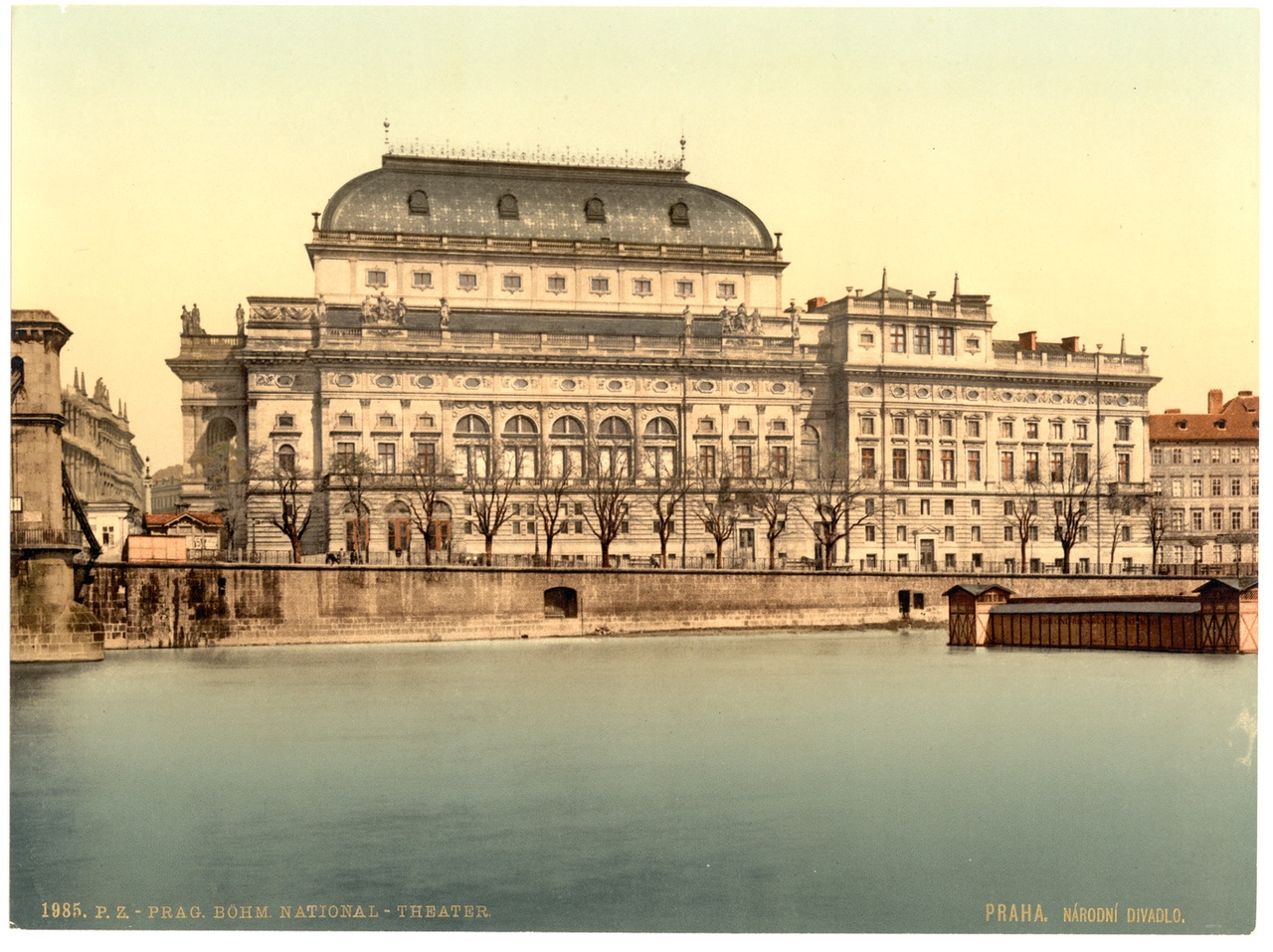 Nineteenth-century colour photochrom of the National Theatre in Prague seen from across the Vltava river