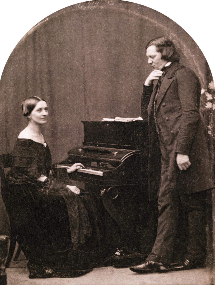 Daguerreotype of Robert and Clara Schumann, with Clara seated at a piano and Robert standing beside her